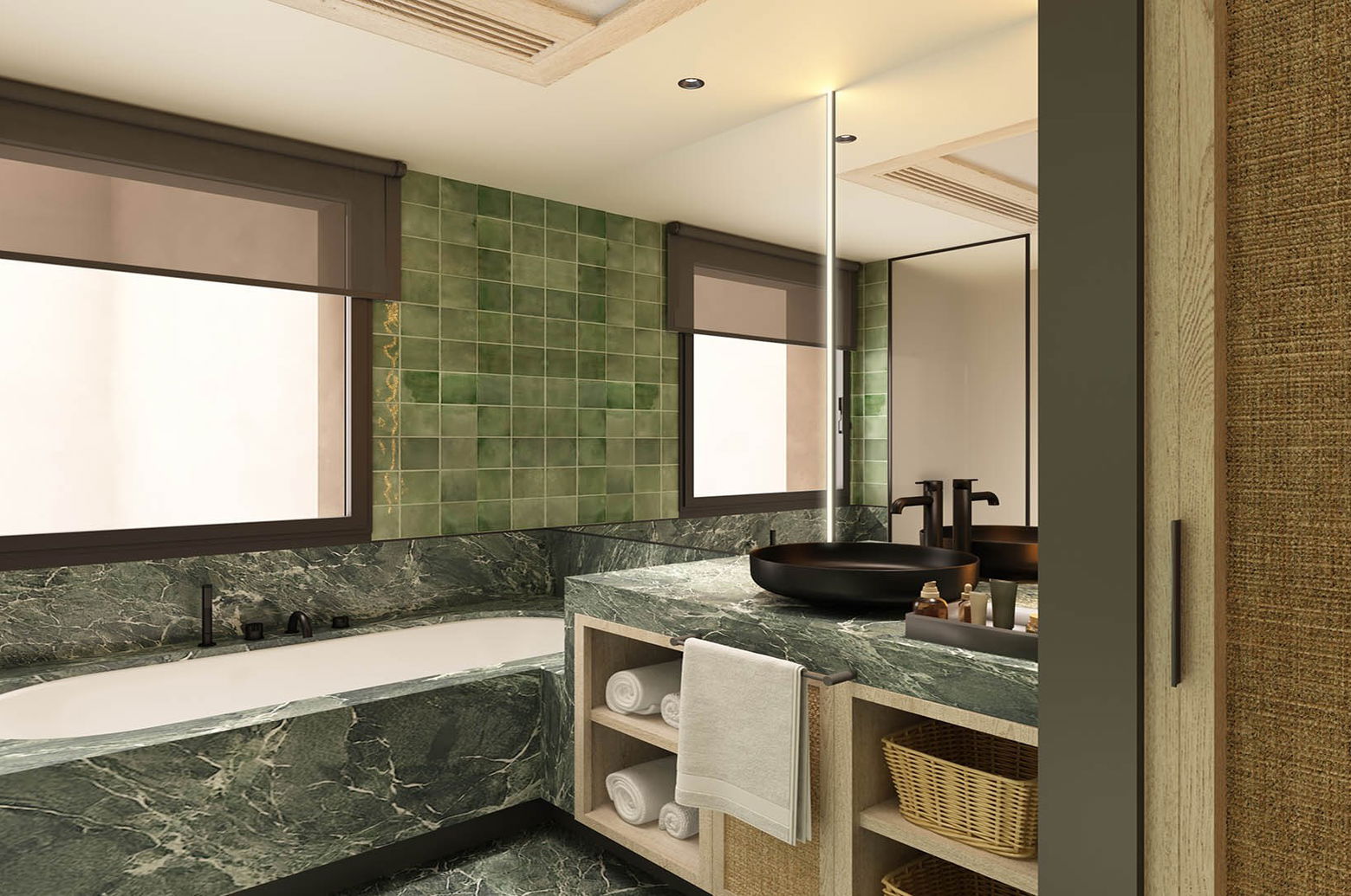 Baño con bañera encastrada en mármol verde bajo la ventana, lavabo negro sobre la encimera y pared de azulejo verde