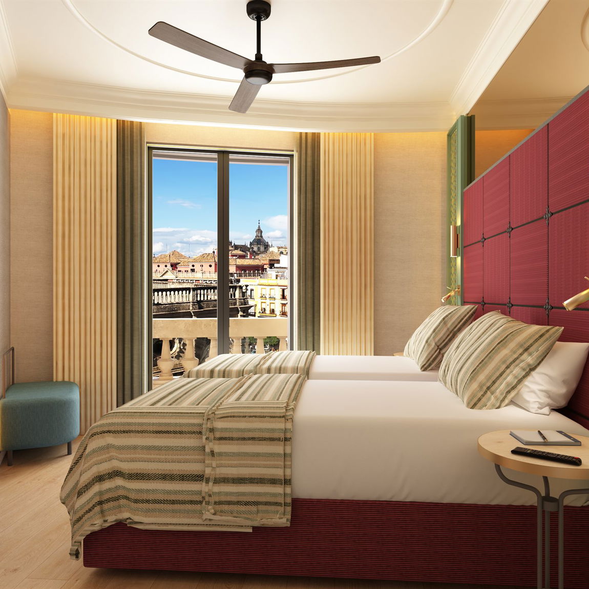 Dormitorio con dos camas individuales, cabecero granate acolchado, ropa de cama a rayas y balcón con vistas a los tejados y torres del centro de Sevilla