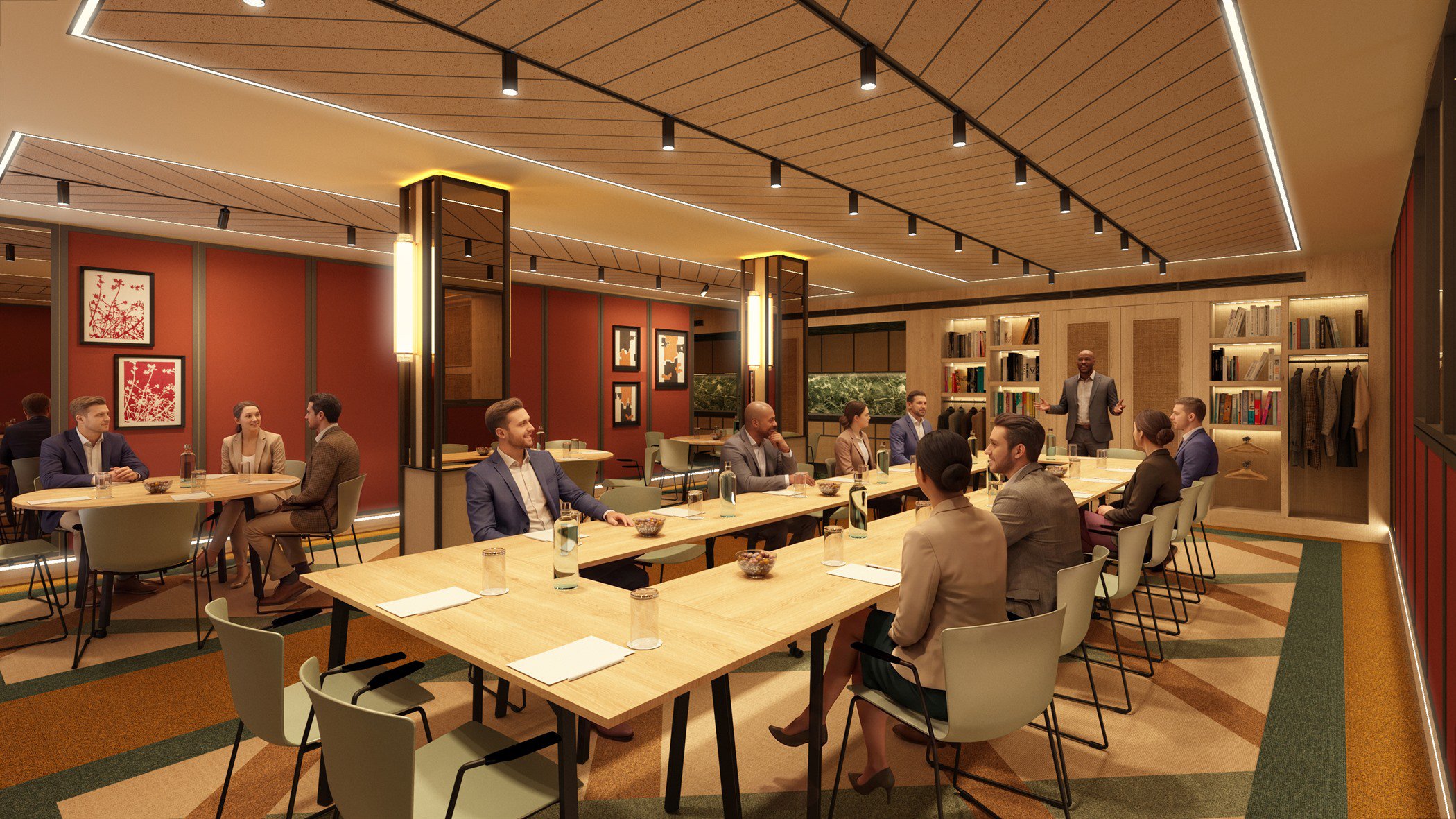 Sala de reuniones con paredes granate, friso de madera y mesa larga preparada para un grupo
