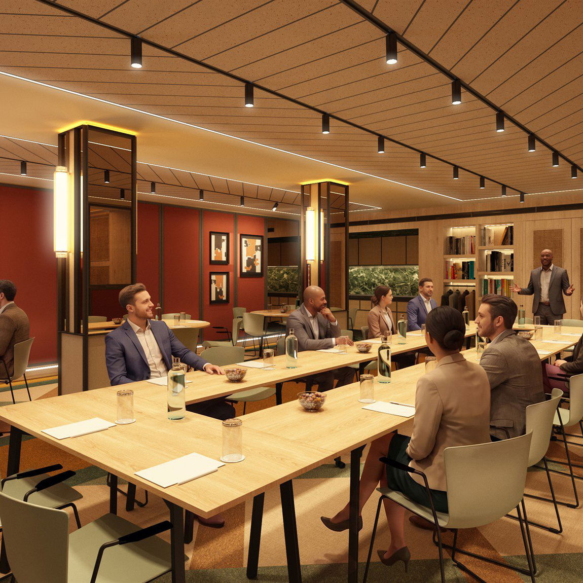 Sala de reuniones con paredes granate, friso de madera y mesa larga preparada para un grupo