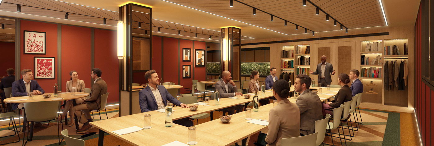 Sala de reuniones con paredes granate, friso de madera y mesa larga preparada para un grupo