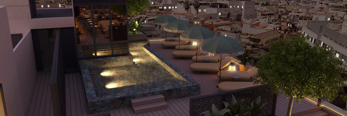 Piscina de la azotea al atardecer con tumbonas, palmeras y vistas al skyline de Sevilla