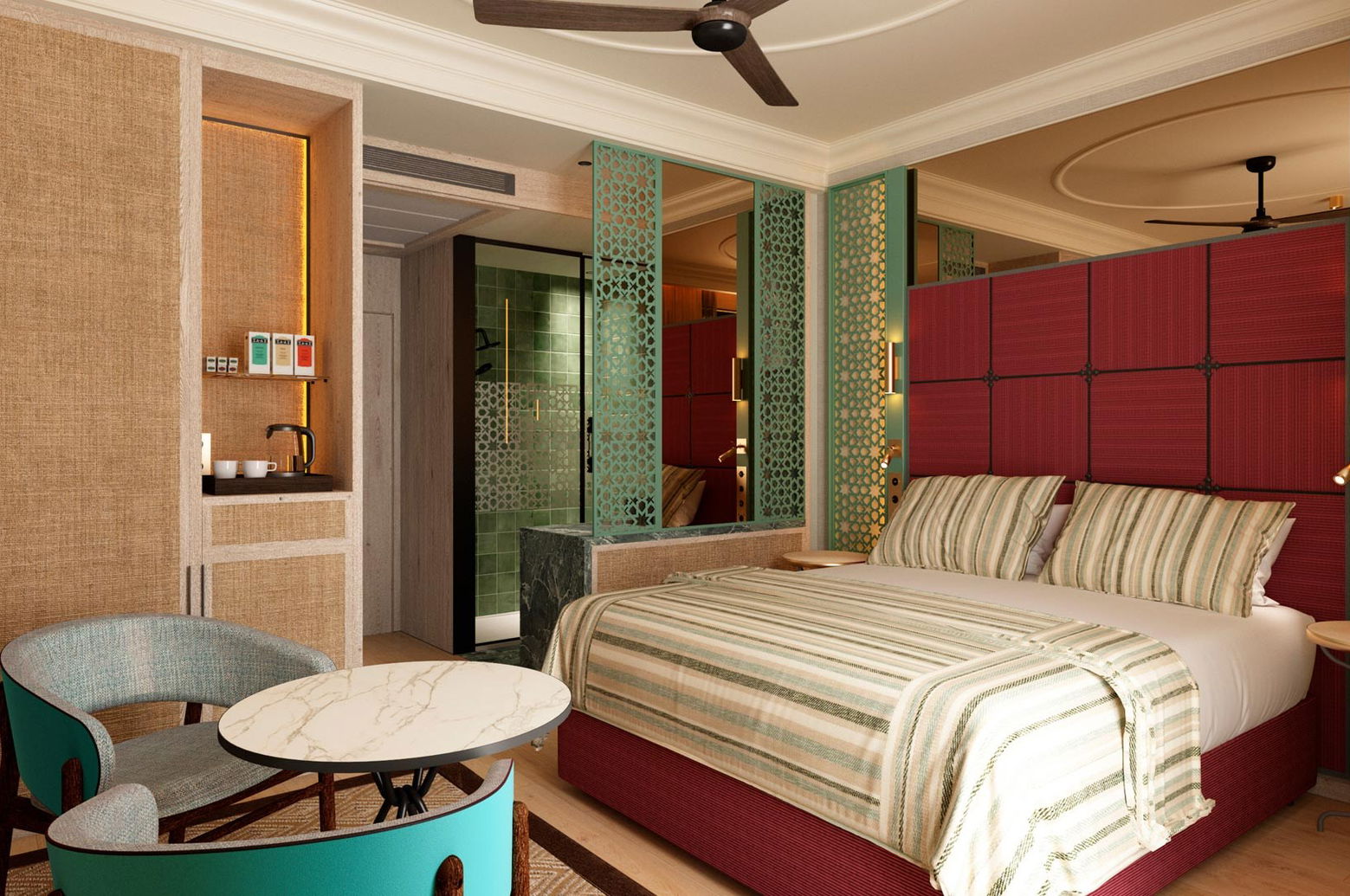 Habitación con cama de matrimonio de cabecero granate, butacas turquesa y rincón con hervidor